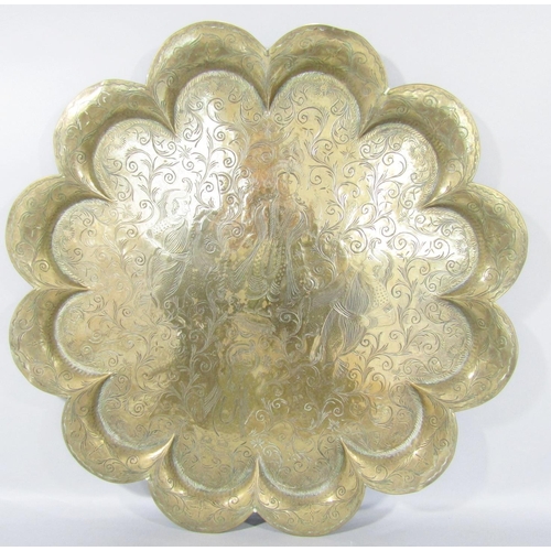 1481 - An Indian brass flower shaped tray with three figures to the centre, a brass antique mortar and a vi... 