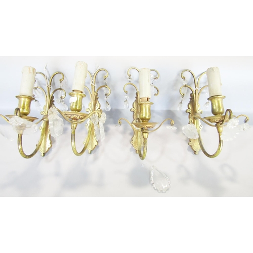 1454 - Set of four cast brass wall lights with scrolled backs, hung with cut glass drops