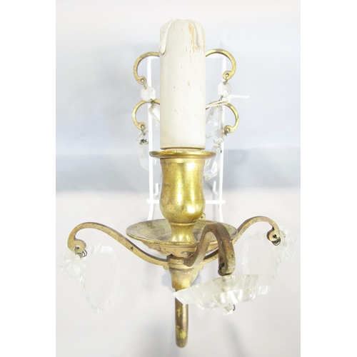 1454 - Set of four cast brass wall lights with scrolled backs, hung with cut glass drops