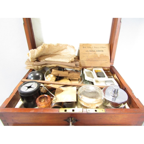 1543 - An Edwardian mahogany dentist’s instrument drawer with a hinged top section containing glass jars, w... 