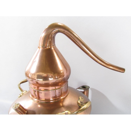 1546 - A vintage copper distiller with brass handles, 39cm high.