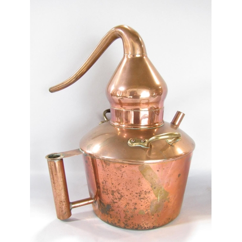 1546 - A vintage copper distiller with brass handles, 39cm high.