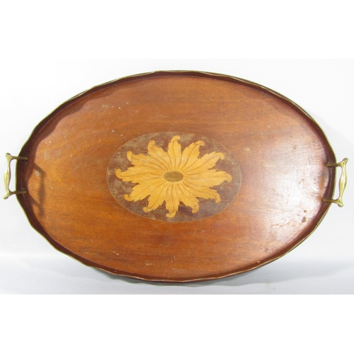 1558 - An Edwardian mahogany oval tray with a central floral inlaid medallion and brass handles, 60cm x 40c... 