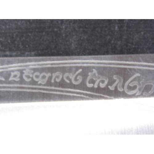 1560 - A large Gurkha type knife stamped India to the blade, and a Hobbit replica sword.