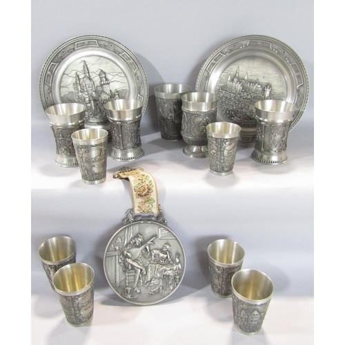 1564 - A collection of Zinn Becker Studgart pewter ware, eleven beakers of varying size, two plates and a m... 