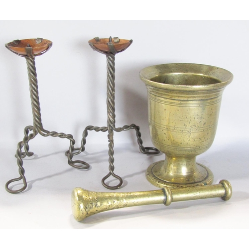 1566 - A 19th century brass pestle and mortar and a pair of Arts and Crafts tripod wire twist candlesticks ... 