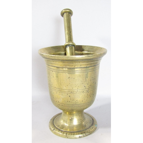 1566 - A 19th century brass pestle and mortar and a pair of Arts and Crafts tripod wire twist candlesticks ... 