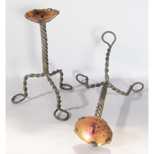 1566 - A 19th century brass pestle and mortar and a pair of Arts and Crafts tripod wire twist candlesticks ... 