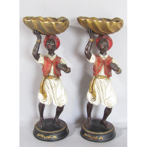 1568 - A pair of Arabian Boy resin statues holding aloft a shell, 28cm tall, a silver metal gun dog car bon... 