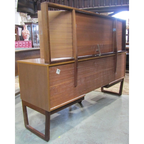 2184 - A Europa Furniture teak veneered kneehole dressing table with triple mirror back over six drawers ra... 