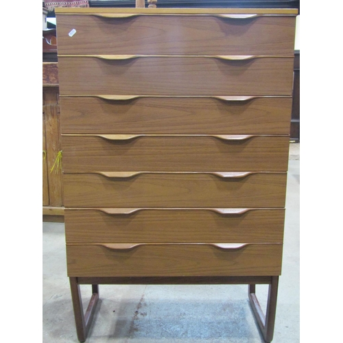 2184 - A Europa Furniture teak veneered kneehole dressing table with triple mirror back over six drawers ra... 