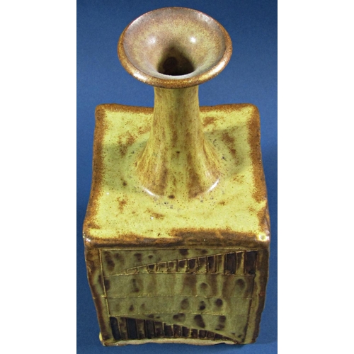 1042 - A studio pottery pot of square cut form with trumpet shaped neck, with simple geometric detail