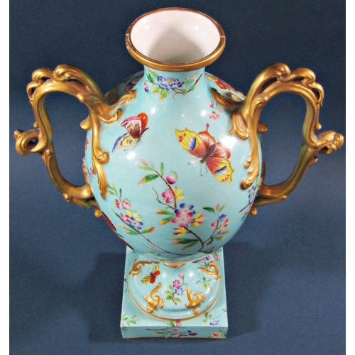 1047A - A Victorian oviform vase in turquoise with panelled detail showing butterflies, moths, floral sprays... 