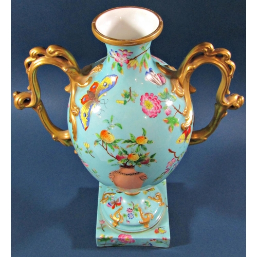 1047A - A Victorian oviform vase in turquoise with panelled detail showing butterflies, moths, floral sprays... 