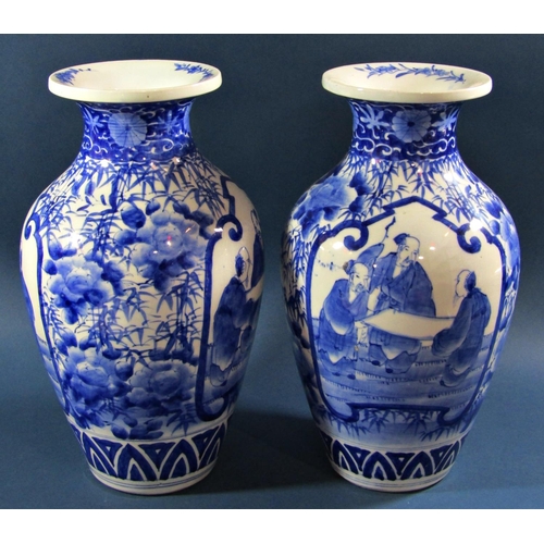 1056 - A pair of Japanese oviform blue and white vases with character and landscape detail, together with a... 