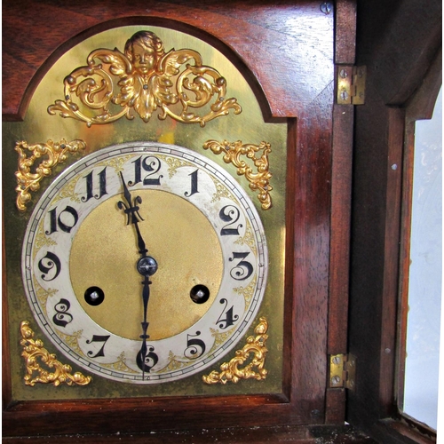 1393 - 19th century German walnut mantle clock enclosing an arched brass dial with silvered chapter ring, t... 