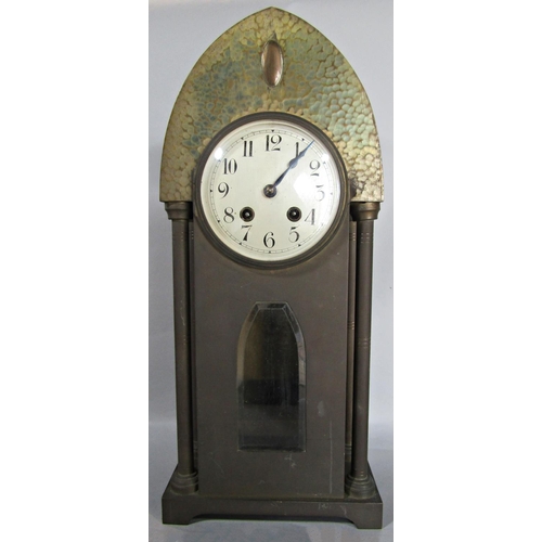 1394 - An art nouveau clock garniture in a hammered metallic finish, the clock with eight day striking move... 