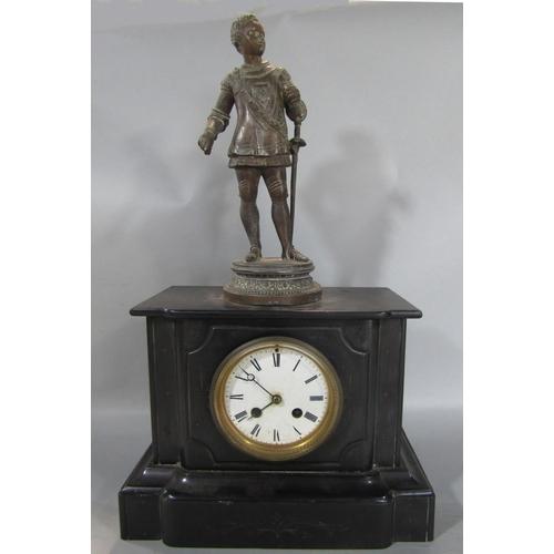 1395 - A Victorian black slate mantle clock with eight day striking movement, surmounted by a spelter figur... 