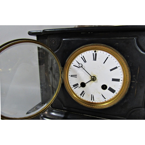 1395 - A Victorian black slate mantle clock with eight day striking movement, surmounted by a spelter figur... 