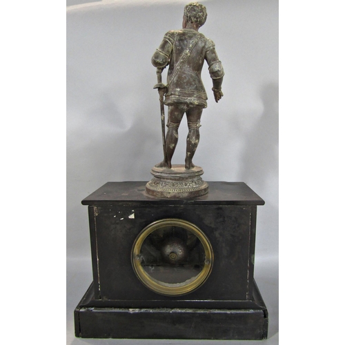 1395 - A Victorian black slate mantle clock with eight day striking movement, surmounted by a spelter figur... 