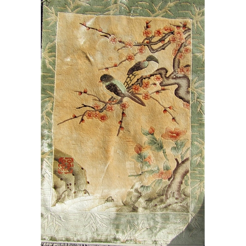 1664 - A Chinese fine silk rug with birds amongst cherry blossom.  95cm x 62cm approx.