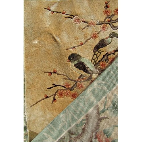 1664 - A Chinese fine silk rug with birds amongst cherry blossom.  95cm x 62cm approx.