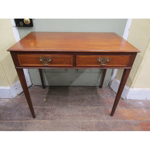 2670 - A Georgian mahogany side table with two frieze drawers on square tapered supports, cross banded in s... 