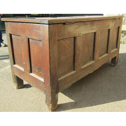 2672 - An 18th century oak coffer, the front elevation enclosed by four panels with repeating floral geomet... 