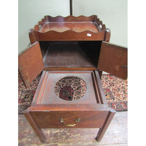 2673 - A Georgian mahogany tray top commode, the front elevation enclosed by the original pull out base, en... 