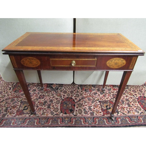 2687 - A rectangular Georgian mahogany foldover top tea table, with cross banding and repeating pen work de... 