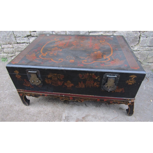 2689 - A Chinese black lacquered box on stand with chinoiserie detail and brass fittings, the stand with sh... 