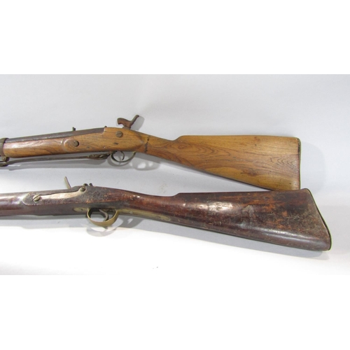 1572 - An 18th century flintlock musket and a 19th century percussion rifle