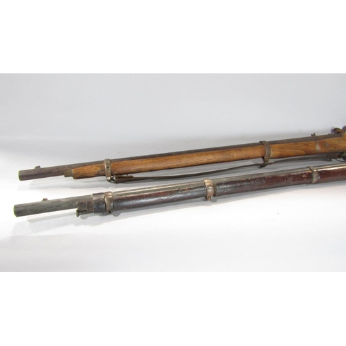 1572 - An 18th century flintlock musket and a 19th century percussion rifle