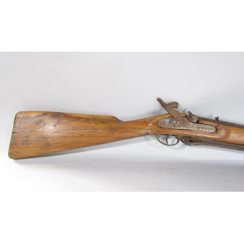 1572 - An 18th century flintlock musket and a 19th century percussion rifle