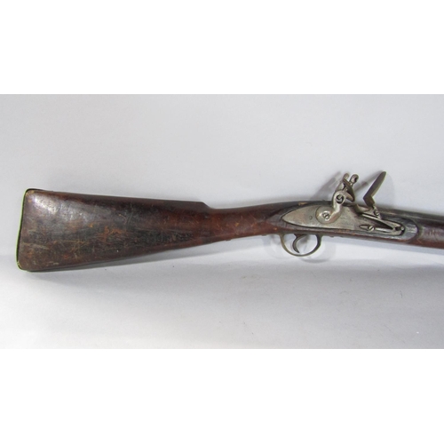 1572 - An 18th century flintlock musket and a 19th century percussion rifle