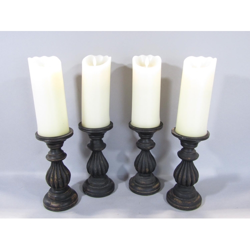 1586 - A timber lazy Susan, four carved timber candlesticks, a further pair, all with ebonised finish