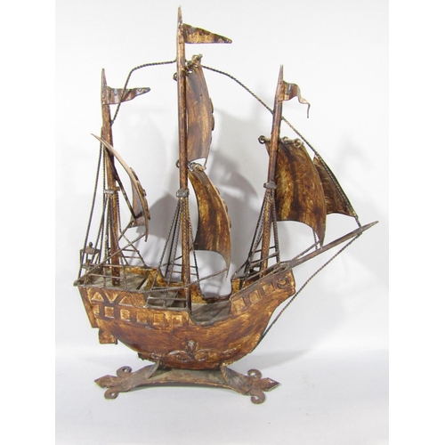 1590 - A three mast galleon in metal under full sail, together with a timber fishing boat, fully fitted wit... 