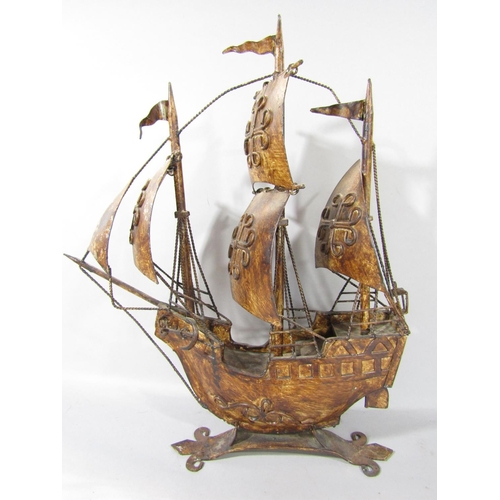 1590 - A three mast galleon in metal under full sail, together with a timber fishing boat, fully fitted wit... 