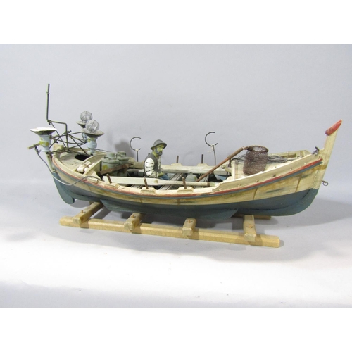 1590 - A three mast galleon in metal under full sail, together with a timber fishing boat, fully fitted wit... 