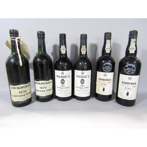 1591 - Six bottles of vintage port comprising Cockburn's 1970, two bottles of Sandeman vintage 1977, two bo... 