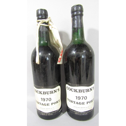 1591 - Six bottles of vintage port comprising Cockburn's 1970, two bottles of Sandeman vintage 1977, two bo... 