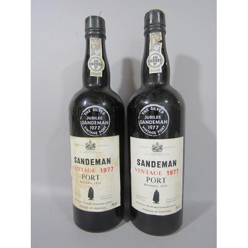 1591 - Six bottles of vintage port comprising Cockburn's 1970, two bottles of Sandeman vintage 1977, two bo... 