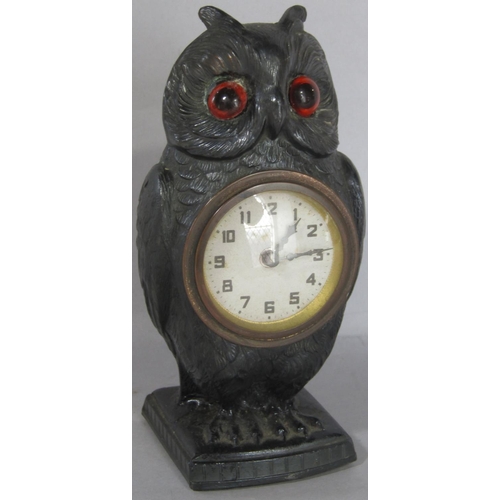 1402 - A spelter bedside or mantle clock in the form of an owl, with eight day time piece