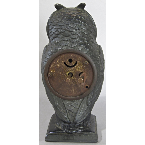 1402 - A spelter bedside or mantle clock in the form of an owl, with eight day time piece