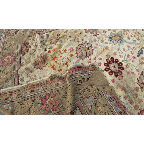 1709 - A large old worn and torn Donegall type carpet with a large floral pattern (af) together with others... 