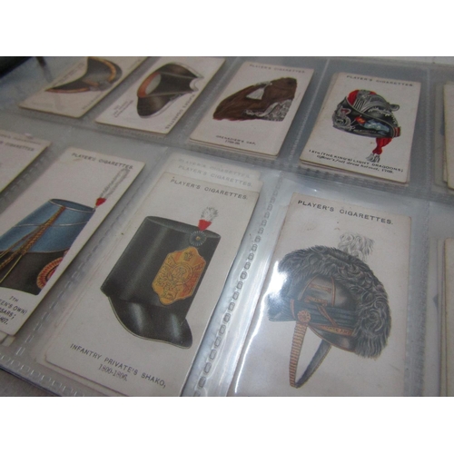 303 - A large collection of cigarette cards with examples by Will's and Players, the majority in albums to... 