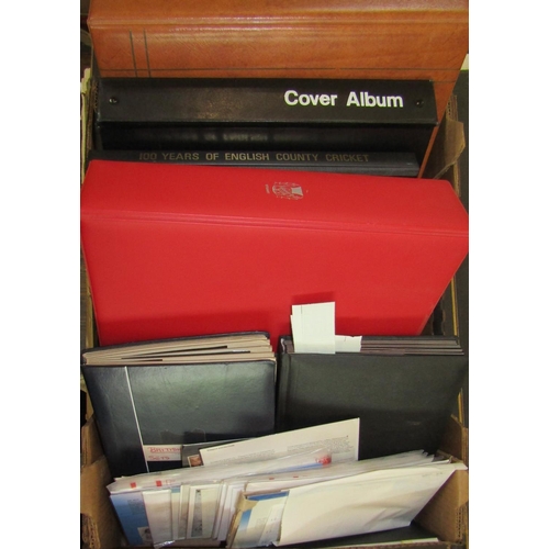 305 - A box containing several albums of British stamps, mainly mid-20th century and later, some mint, num... 