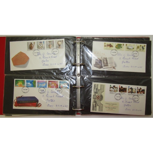 305 - A box containing several albums of British stamps, mainly mid-20th century and later, some mint, num... 