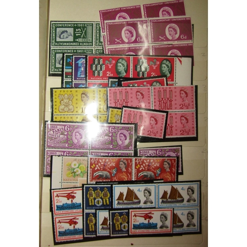 305 - A box containing several albums of British stamps, mainly mid-20th century and later, some mint, num... 