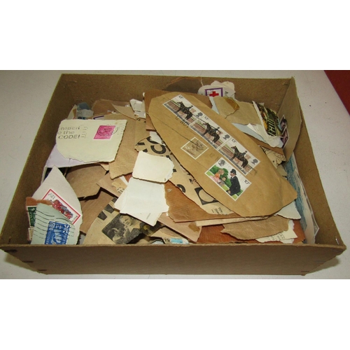 311 - A box of miscellaneous stamps, many from torn envelopes, mainly mid-20th century and later, a quanti... 